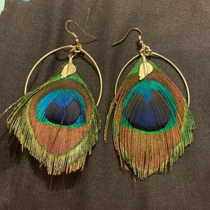 Gold hoops with peacock feather